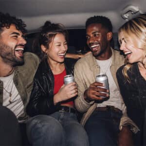 passengers drinking in a car